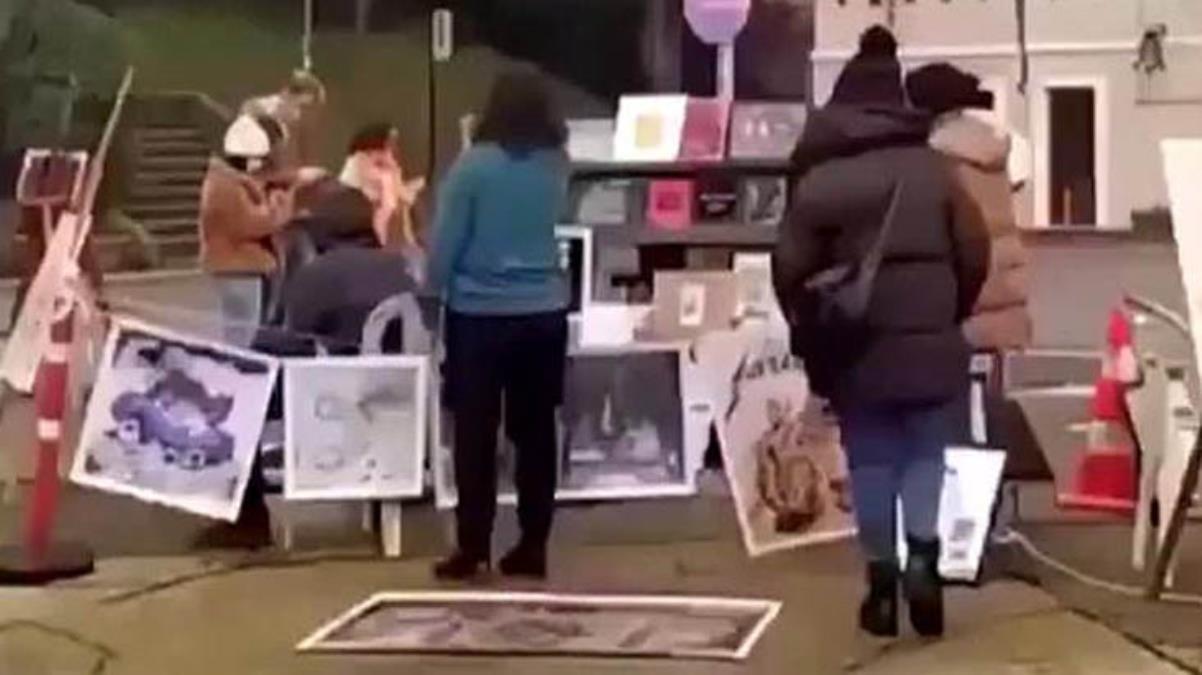 Kabe fotoğrafını yere seren 2 kişi tutuklandı